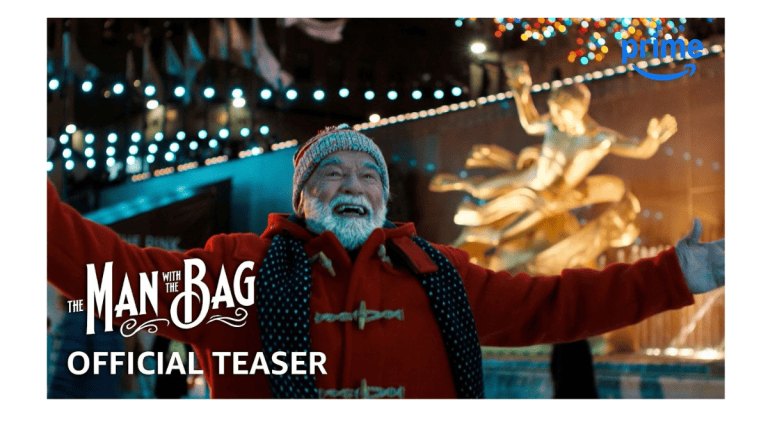 Arnold Schwarzenegger as Santa Claus beside Alan Ritchson in The Man With the Bag